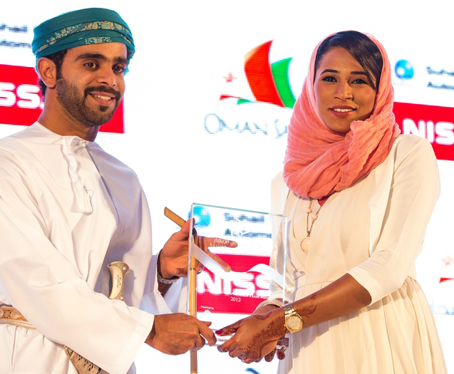 Hussain & Intisar accepting award