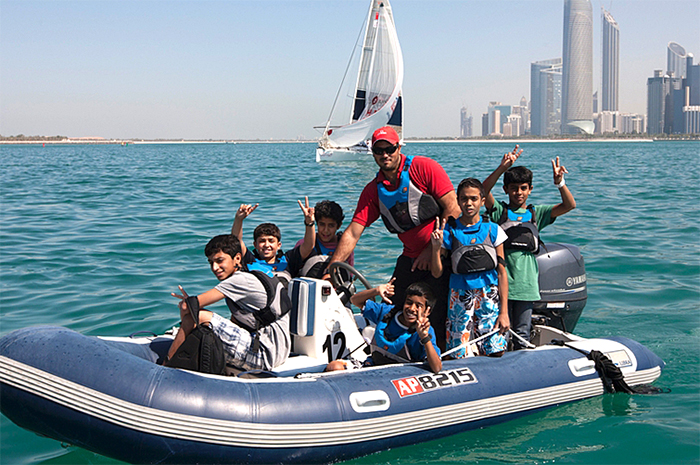 Kids watching in-port racing in Abu Dhabi